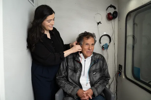 audiology patient completing hearing test